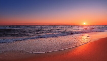 Fototapeta premium Waves on the beach at red sunset