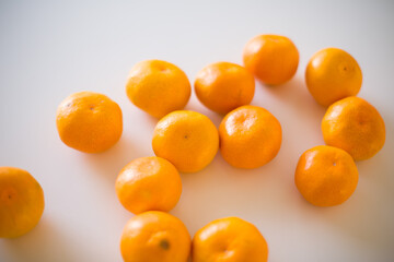 Tangerine Arranged on White Table Surface