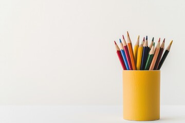 A vibrant collection of colored pencils arranged in a yellow pencil holder, perfect for art projects, creativity, and educational activities.