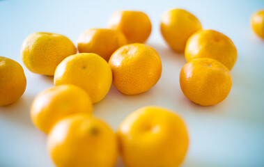 Oranges Arranged on White Table Surface