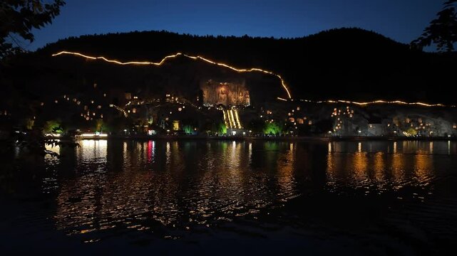 Luoyang, China: Panoramic footage of the famous Luoyang Longmen Grottoes with the famous Vairocana Buddha statue at night in Henan province in China. 