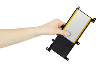 laptop battery in hand isolated from background, concept of hand over or throw away	