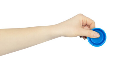 wide cap from a plastic bottle in hand, outstretched hand with cap from a plastic bottle isolated from background	