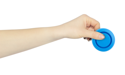wide cap from a plastic bottle in hand, outstretched hand with cap from a plastic bottle isolated from background	