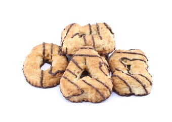 Homemade shortbread cookies, with strips of chocolate topping, of different shapes. White background.