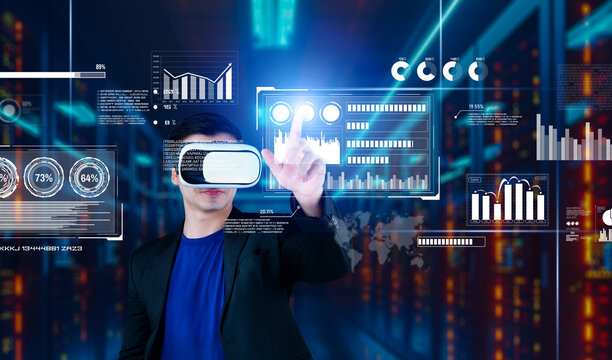 Businessman with headset standing at data center while analyzing financial data. Manager pointing marketing statistic hologram and using augmented reality goggles while making a decision. Ingenuity.