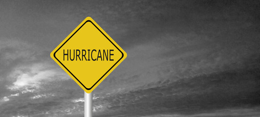 danger,caution,Hurricane Idalia warning sign against a powerful stormy background with copy space. Dirty and angled sign with cyclonic winds add to the drama.hurricane season sign on cloudy background