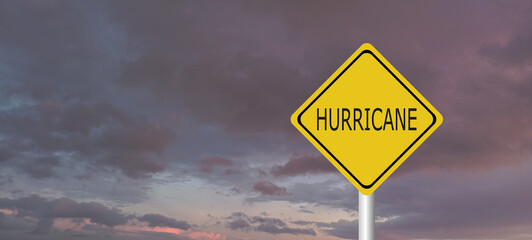 danger,caution,Hurricane Idalia warning sign against a powerful stormy background with copy space. Dirty and angled sign with cyclonic winds add to the drama.hurricane season sign on cloudy background
