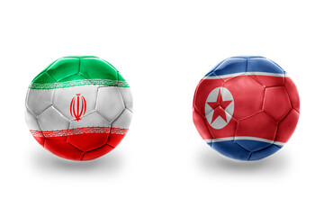 football balls with national flags of north korea and iran ,soccer teams. on the white background.