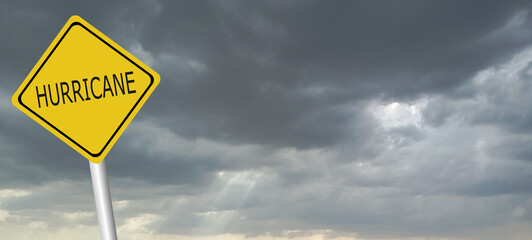 danger,caution,Hurricane Idalia warning sign against a powerful stormy background with copy space. Dirty and angled sign with cyclonic winds add to the drama.hurricane season sign on cloudy background