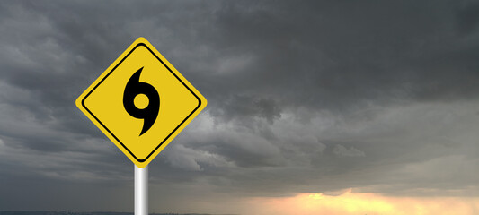 danger,caution,Hurricane Idalia warning sign against a powerful stormy background with copy space. Dirty and angled sign with cyclonic winds add to the drama.hurricane season sign on cloudy background