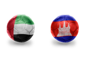 Obraz premium football balls with national flags of cambodia and united arab emirates ,soccer teams. on the white background.