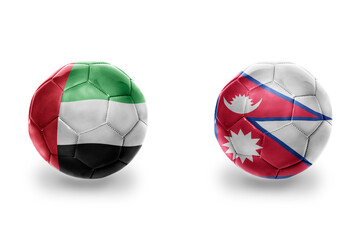 Obraz premium football balls with national flags of nepal and united arab emirates ,soccer teams. on the white background.