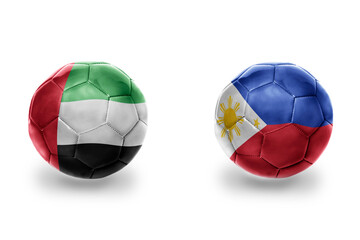 Fototapeta premium football balls with national flags of philippines and united arab emirates ,soccer teams. on the white background.