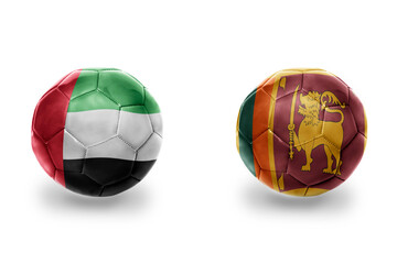 football balls with national flags of sri lanka and united arab emirates ,soccer teams. on the...