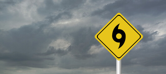 danger,caution,Hurricane Idalia warning sign against a powerful stormy background with copy space. Dirty and angled sign with cyclonic winds add to the drama.hurricane season sign on cloudy background