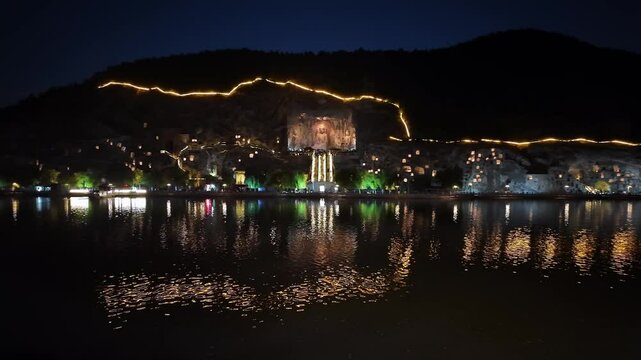 Luoyang, China: Panoramic footage of the famous Luoyang Longmen Grottoes with the famous Vairocana Buddha statue at night in Henan province in China. 