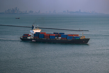 Large container ship at sea. Aerial view of cargo container ship vessel import export container sailing. Large ship sails in the middle of the sea.