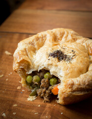 Close up of Australian meat pie with bite taken out