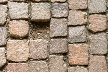 Block of paving stones building a pathway, where one stone is missing, leaving a gap. Concept of...
