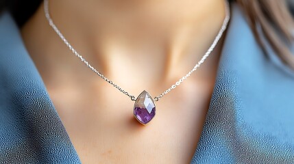 The purple gemstone on this necklace is believed to have healing properties, promoting inner peace and balance while adding a touch of spiritual energy to your everyday look.