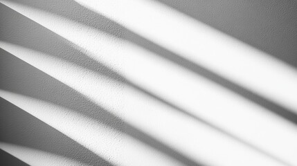 Obraz premium Horizontal blinds with a textured finish, partially closed on a bright white background, highlighting clean, minimal lines.