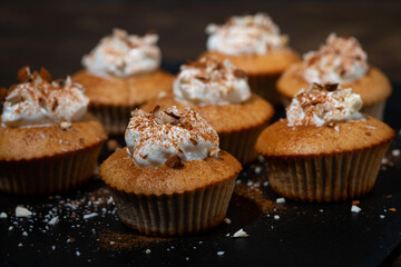 portioned mini cakes with whipped cream