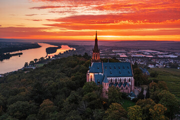 Fototapeta premium Aerial view of the Rochus Chapel near Bingen am Rhein in autumn at sunrise