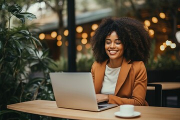 Fototapeta premium Joyful african woman laptop computer typing.