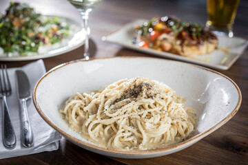Spaghetti in butter sauce on dinner table