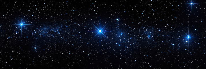 Fototapeta premium Countless stars shine brightly against the dark canvas of the night, creating a mesmerizing view of the cosmos above a tranquil setting