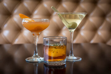 Various mixed drinks sitting on wood table