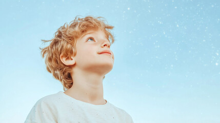 Blond boy gazing at starry sky with dreamy expression, background, concept of imagination