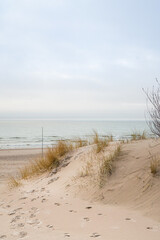 Path leading by the grass sand dunes to the Baltic Sea coastline in Ventspils, Latvia
