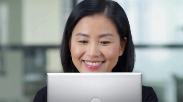 A focused Chinese woman working diligently on her laptop. Generative AI