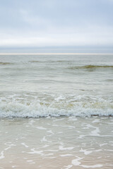 Pastel colored Baltic sea on a sunny summer day with blue sky, Latvia