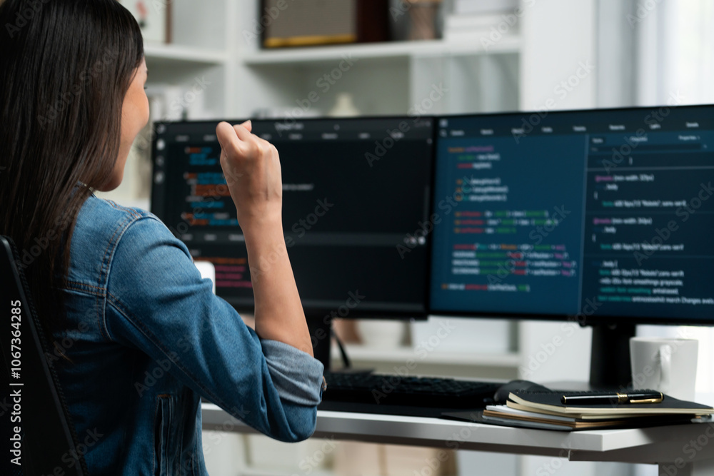 Poster young asian it developer creating raising fist up with successful information on pc with coding prog