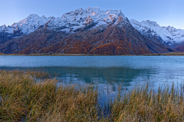 First light of sunirse on Meije massif and Pontet lake