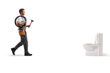 Plumber walking towards a toilet with a plunger and drain snake