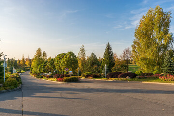 Entrance to the territory of the golf club. Magnificent landscape against the background of autumn...