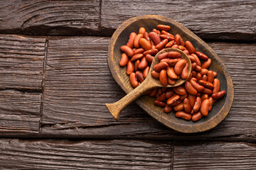 Phaseolus vulgaris - Raw dried beans in bowl and spoon.