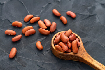 Phaseolus vulgaris - Raw dried beans on a spoon.