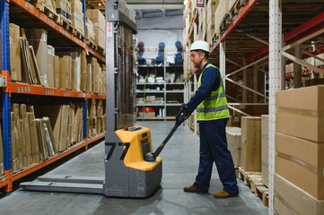 Man Driving Fork Lift Truck In Warehouse © Serhii