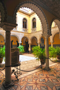 Courtyard with Roman sculptures and mosaics. Palace of the Countess of Lebrija (Palacio de la Condesa de Lebrija) in Seville, Andalusia, Spain. Palace houses in Seville