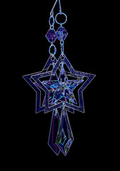 Abstract blue hanging stars on a black background