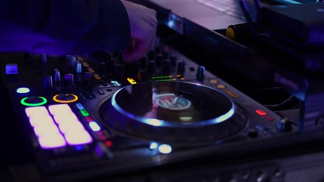 A closeup of a DJs hands on a vibrant mixing console, highlighting the colorful buttons and turntables, perfect for music and nightlife themes