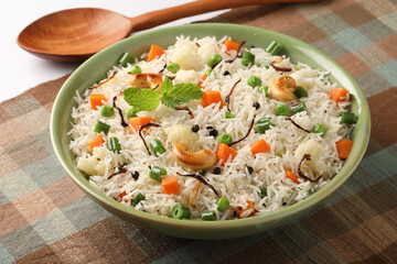 Indian veg biryani, veg pulav, Indian vegetable pulav, Biriyani, vegetable Biriyani served in a ceramic bowl