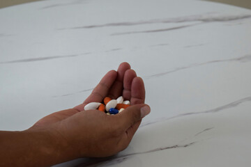 young man hands holding pills. healthcare concept