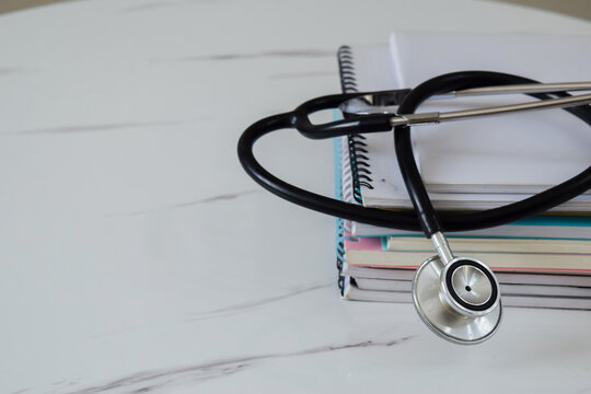 Concept of medical college student with stack of books