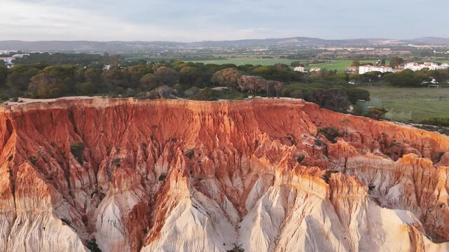 Close-up view of the colorful sandstone cliffs on Praia da Falesia. Olhos de Agua, Portugal